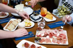A photo showing friends eating starters in NoLIta