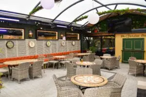 A photo that shows one of the outdoor spaces in The Railway Bar.