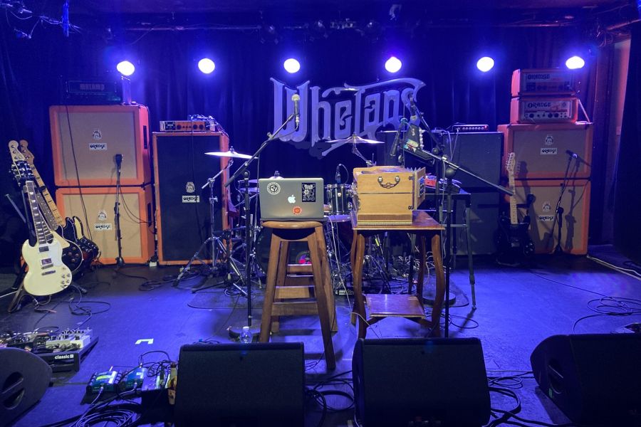 A photo of a stage in Whelan's with musical equipment on it.