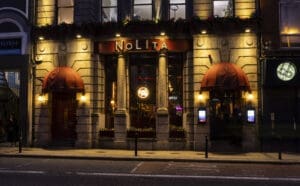 A photo of the NoLIta exterior at night time