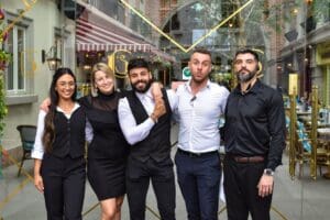 5 employees lined up for a group photo