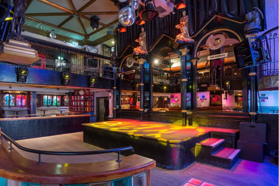 A photo that shows the club inside of The George.